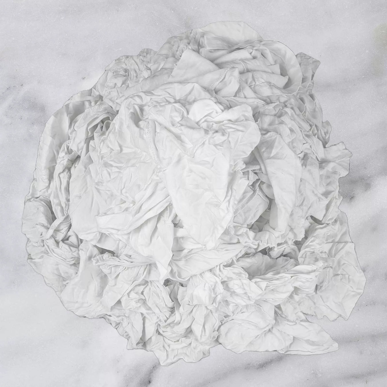 Pile of white cotton T-shirt cleaning rags