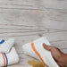 Set of four Wiping Hub premium terry bar mop towels, showing soft, absorbent white cotton towels for cleaning and drying.