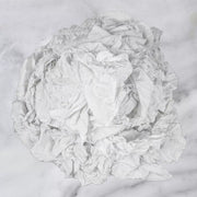 Recycled white knit T-shirt cleaning rags, industrial towels from Wiping Hub, suitable for industrial cleaning and wiping tasks.