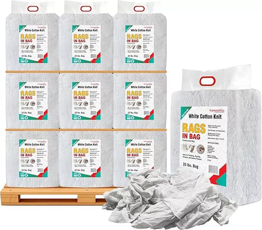 Recycled white knit T-shirt cleaning rags from Wiping Hub, industrial towels on pallet, 25 lbs bag for heavy-duty cleaning tasks.