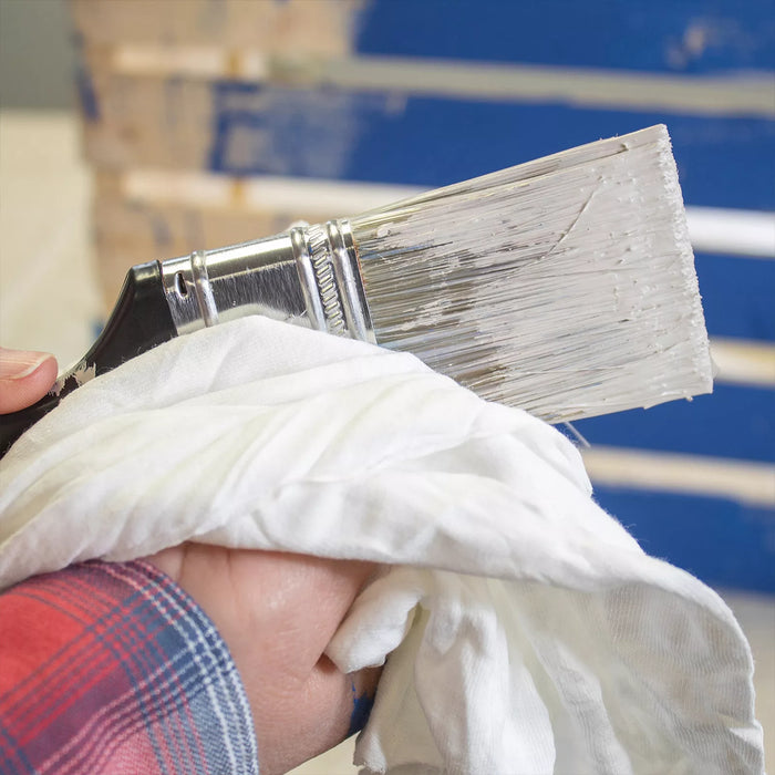 White washed T-shirt material rags from Wiping Hub, ideal for cleaning and wiping tasks, shown in use for versatile cleaning applications.