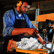 Recycled white knit T-shirt cleaning rag, industrial towel from Wiping Hub, used for industrial cleaning and wiping tasks.